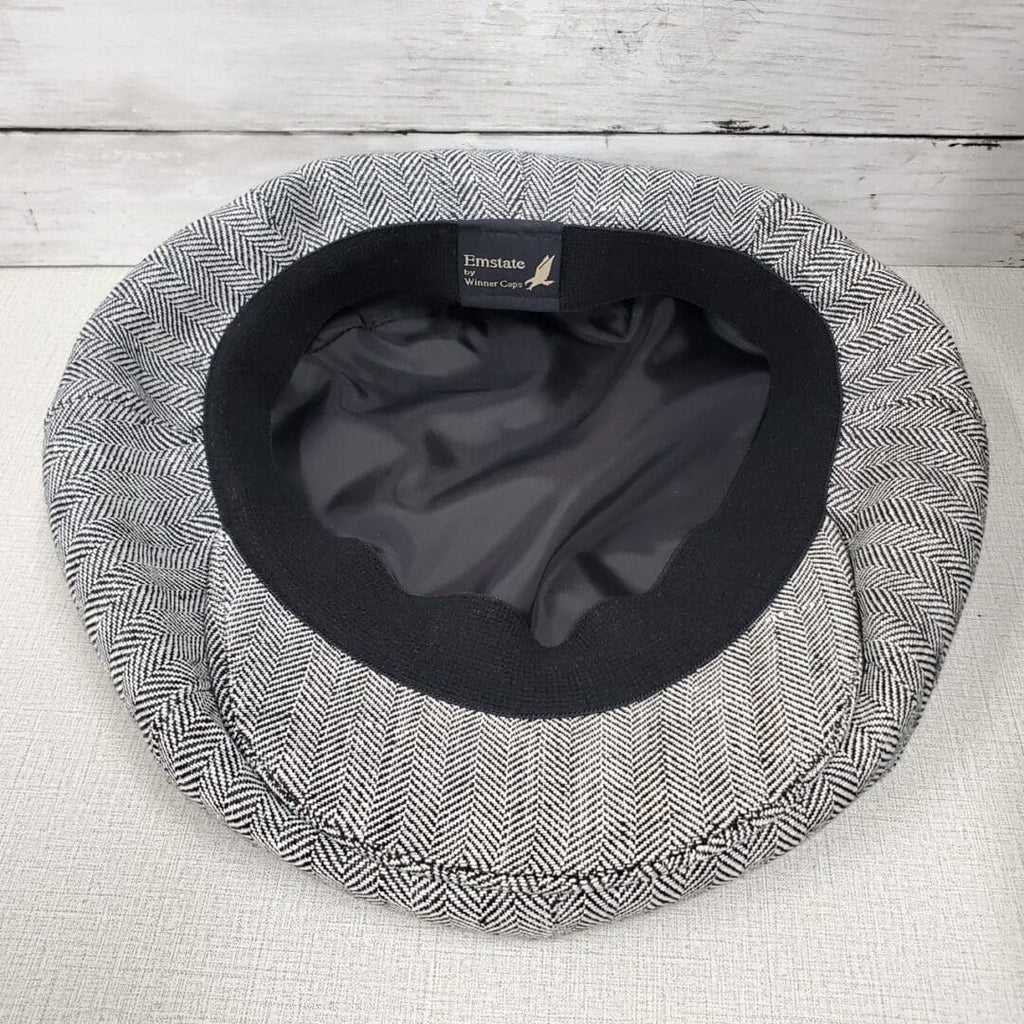 A dog bed with a black and white pattern.