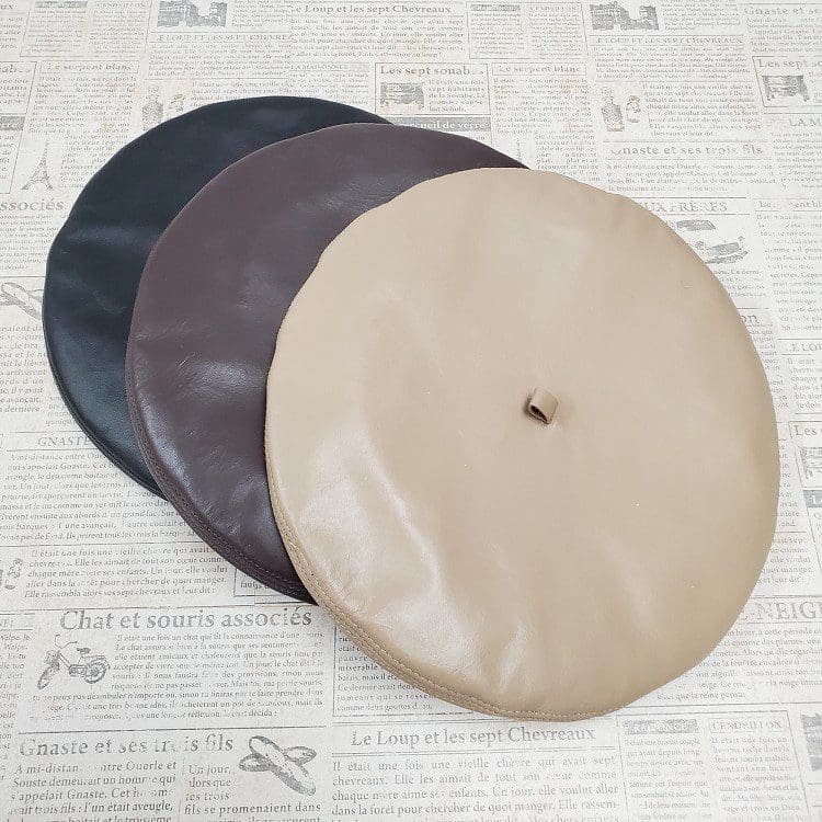 A group of three discs sitting on top of a table.