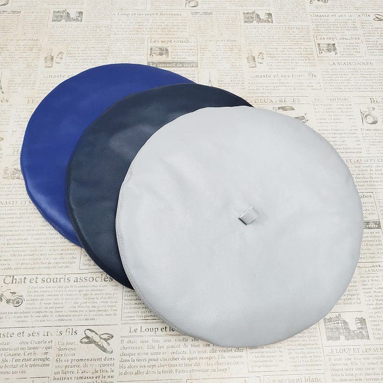 A group of three discs sitting on top of a table.