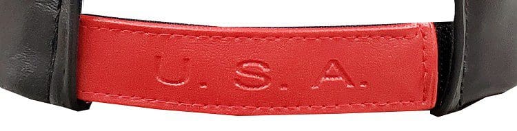 A red leather strap with the letters s. A. M.