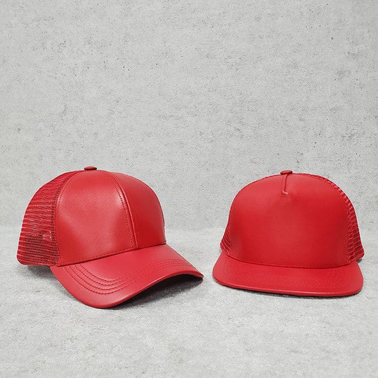 A red hat is next to another red hat.