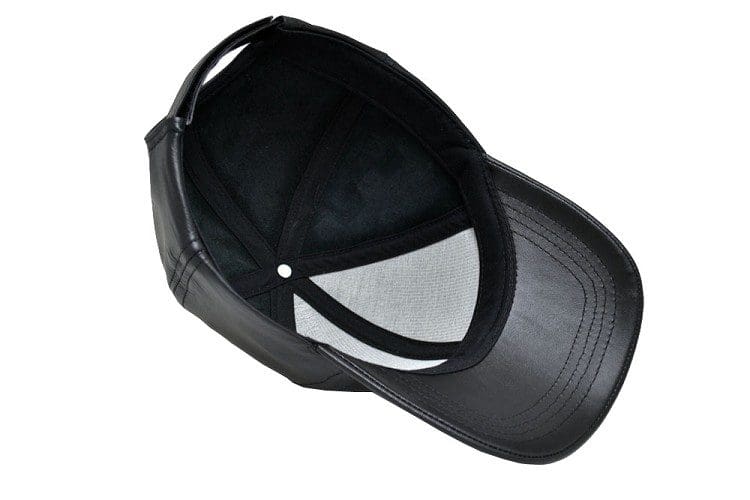 A black hat with a white patch on the side of it.