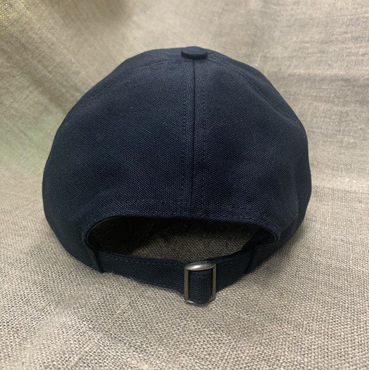 A black hat is on the ground