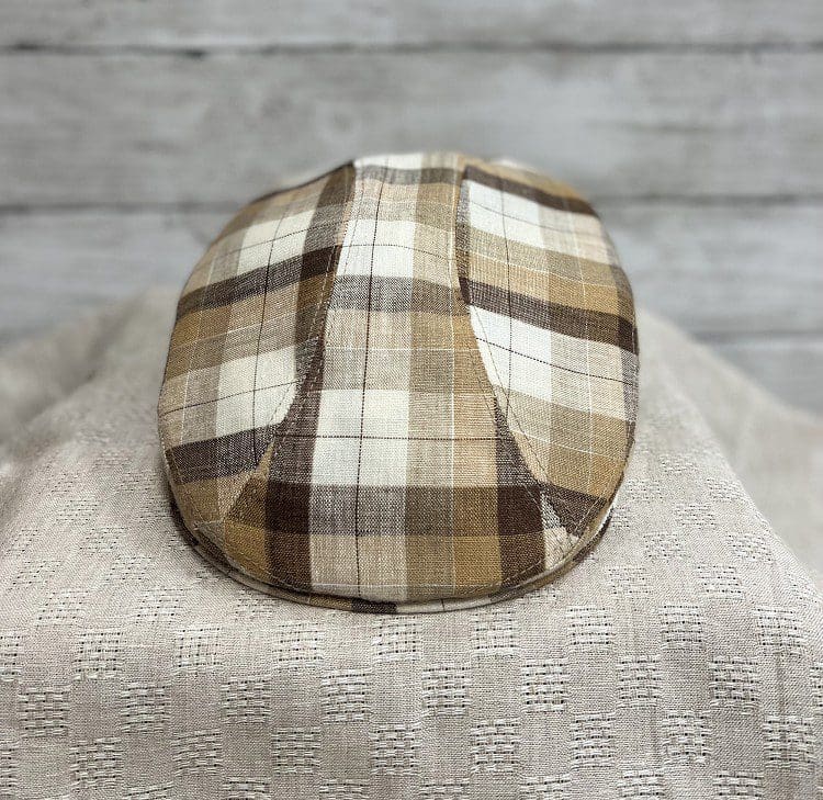 A close up of the top of a hat on a blanket