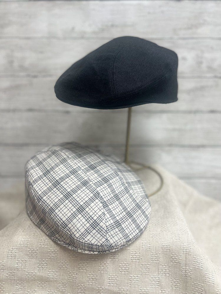 A close up of two hats on display