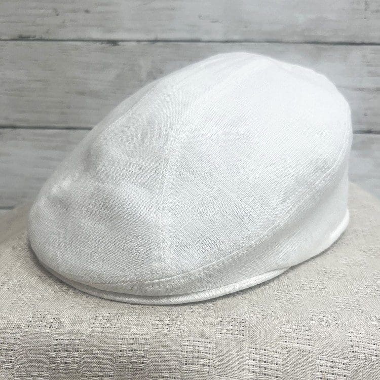 A white hat sitting on top of a table.
