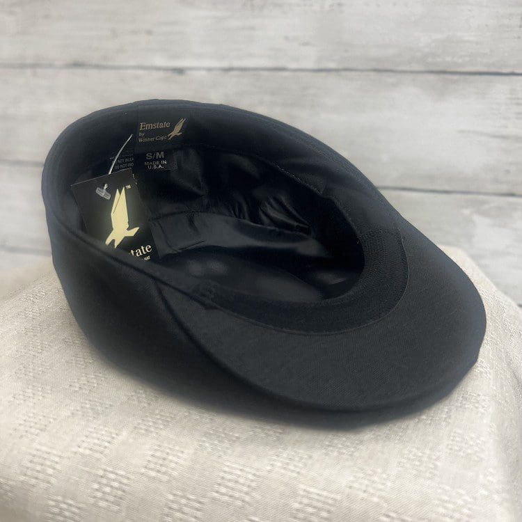 A black hat sitting on top of a table.