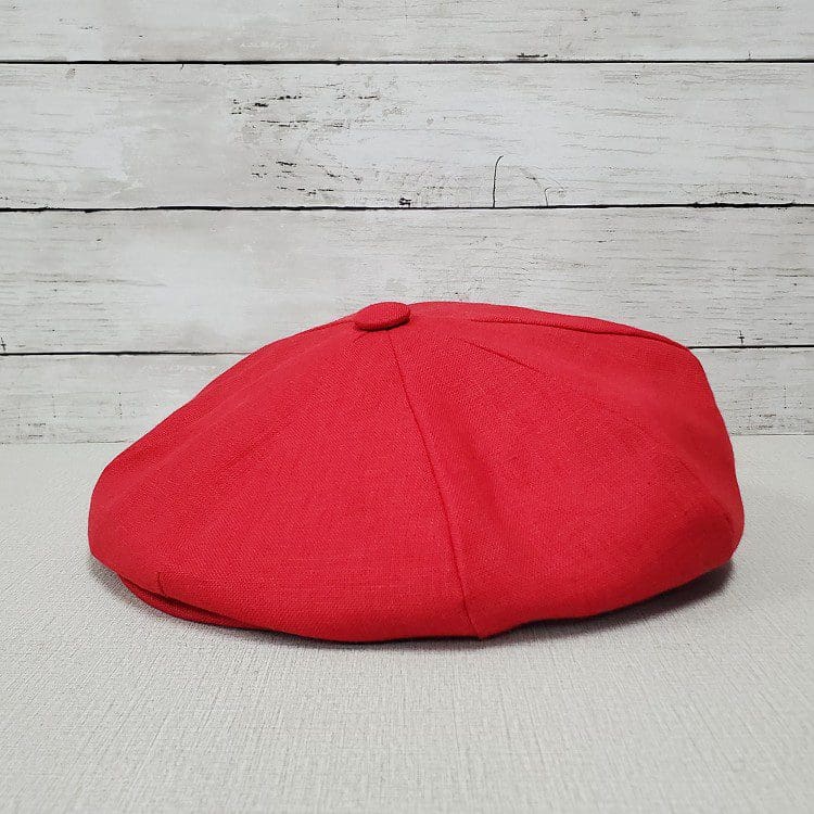 A red hat is sitting on the floor