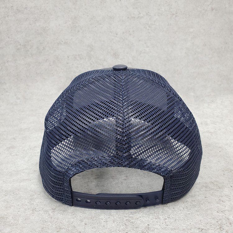 A blue hat with a black and white logo on it