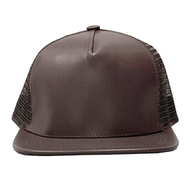 A brown leather hat with black mesh on top of it.