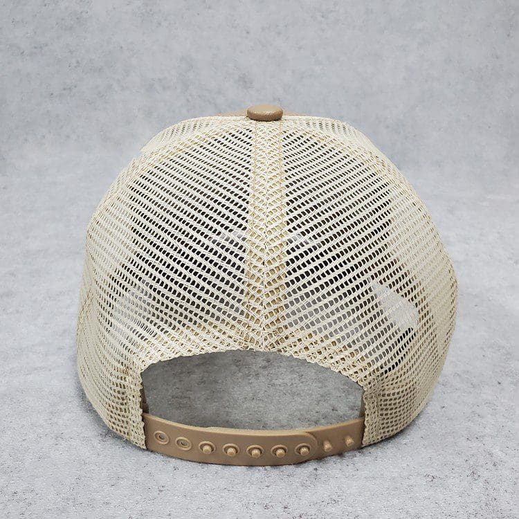 A tan hat with a brown leather brim