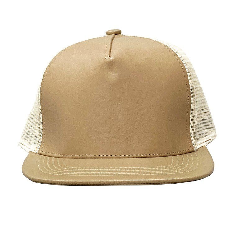 A tan hat with white mesh on top of it.