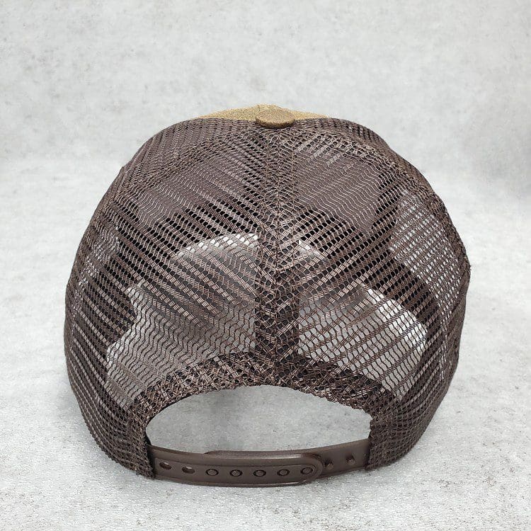 A brown hat with a yellow patch on it