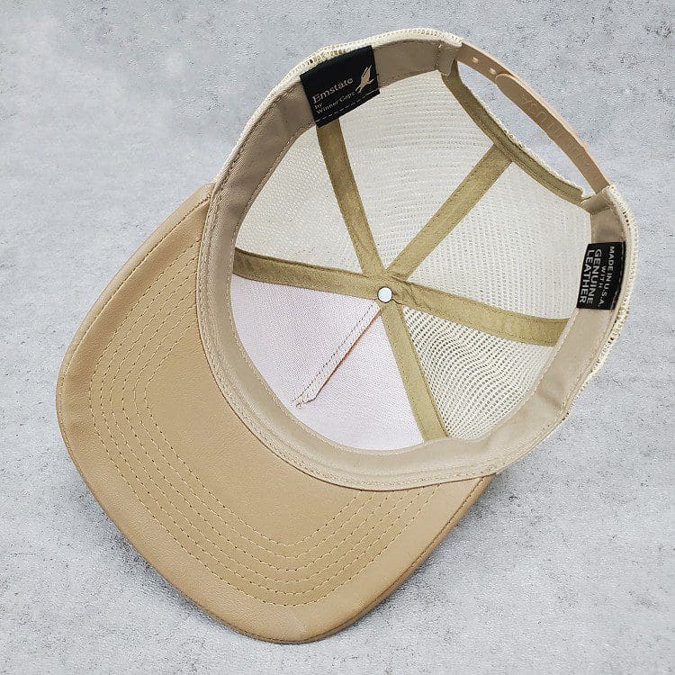 A cap that is sitting on the ground.