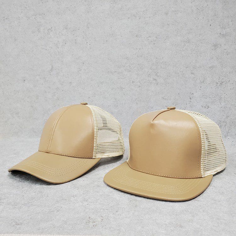 Two hats are shown side by side on a white surface.