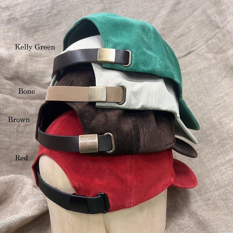A hat with different colors of leather and metal.